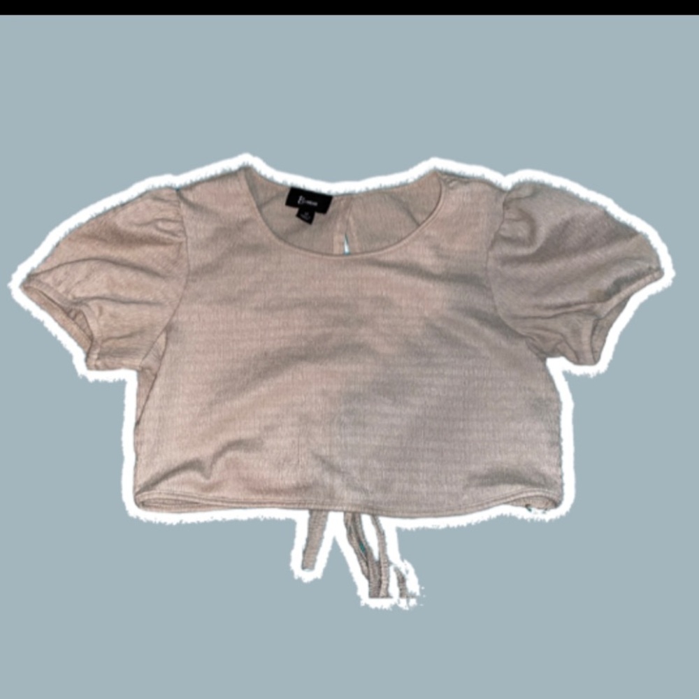 B.wear beige tie back cropped blouse.